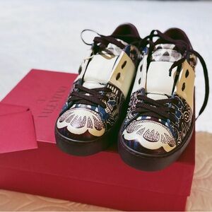 VALENTINO GARAVANI
Studded printed leather sneakers